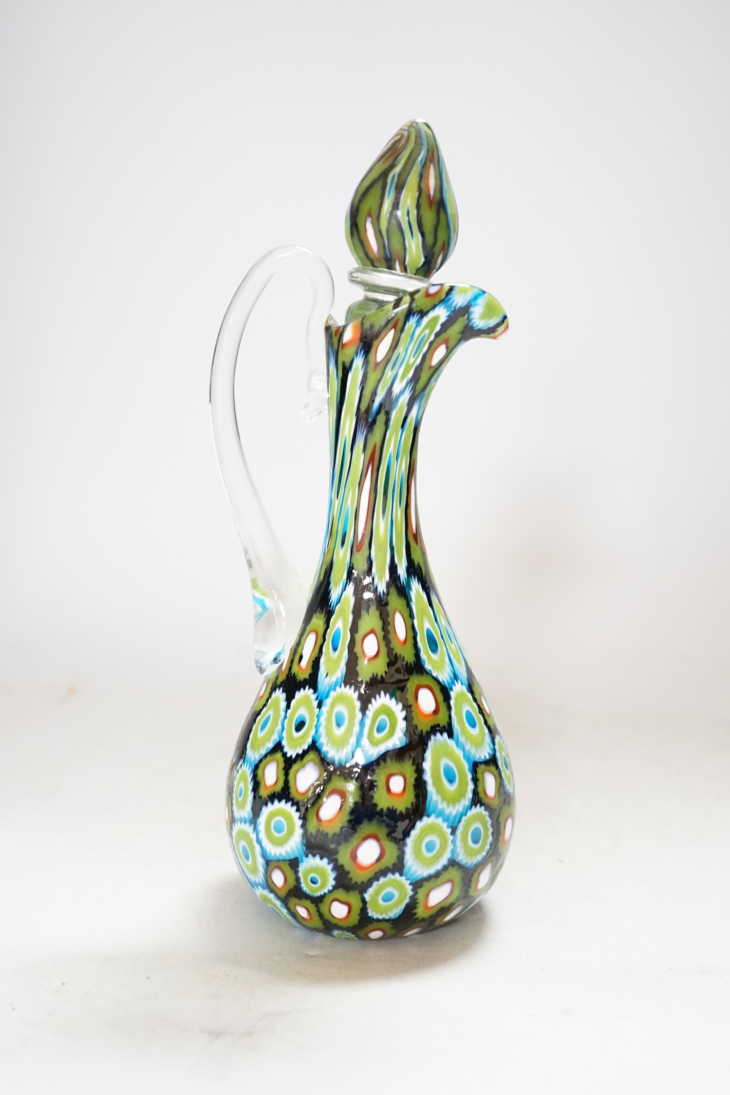 A Murano glass Murrine carafe and stopper, unsigned, 23cm, Please note this lot attracts an additional import tax of 20% on the hammer price